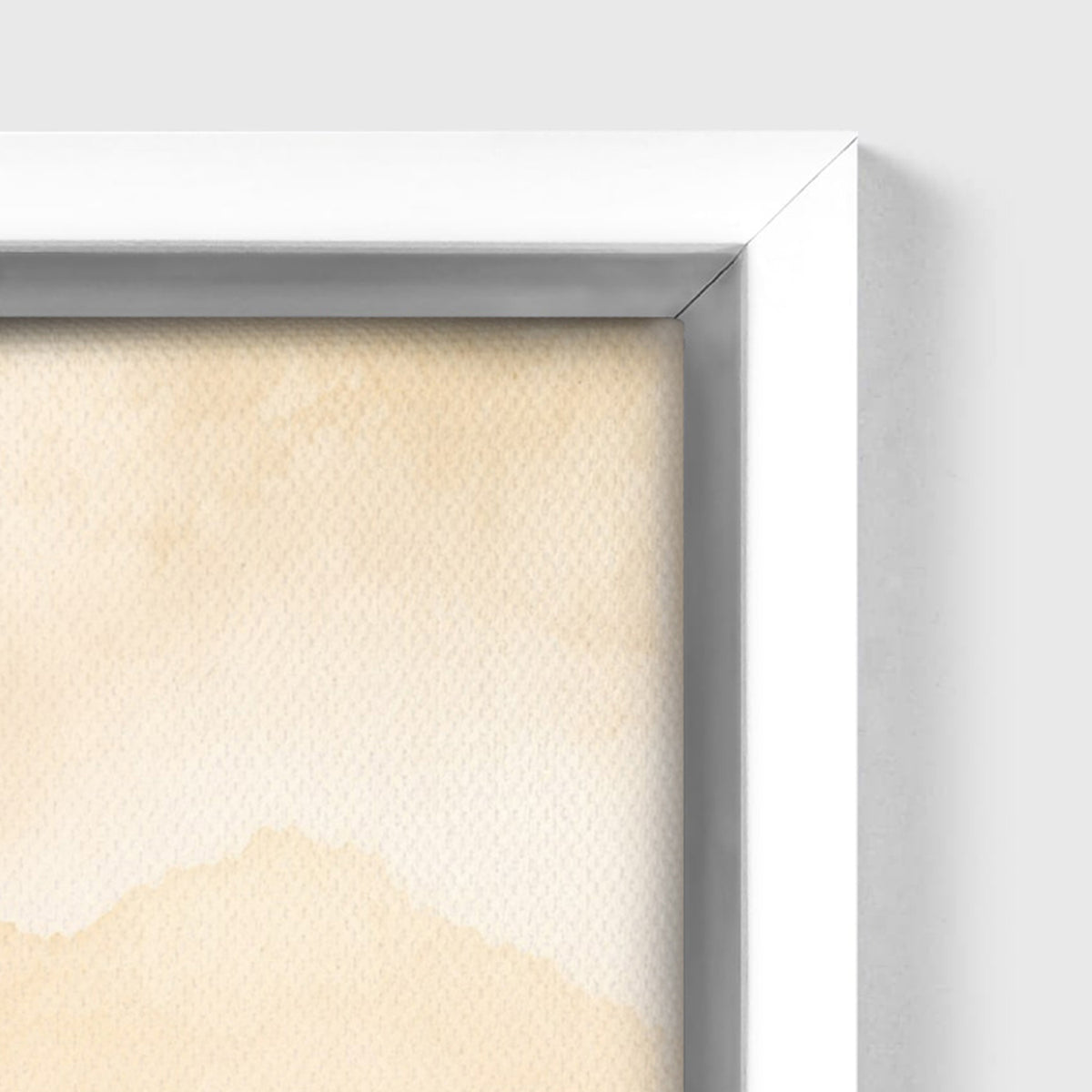 Close-up of a framed art print with a white frame and a textured beige watercolor background, shown against a light gray wall.